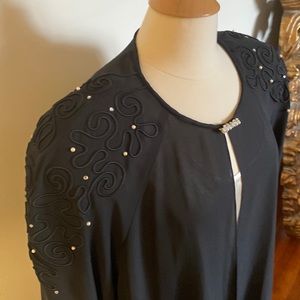 Black polyester evening jacket; clasp, shoulder decor of pearls and Rhinestones